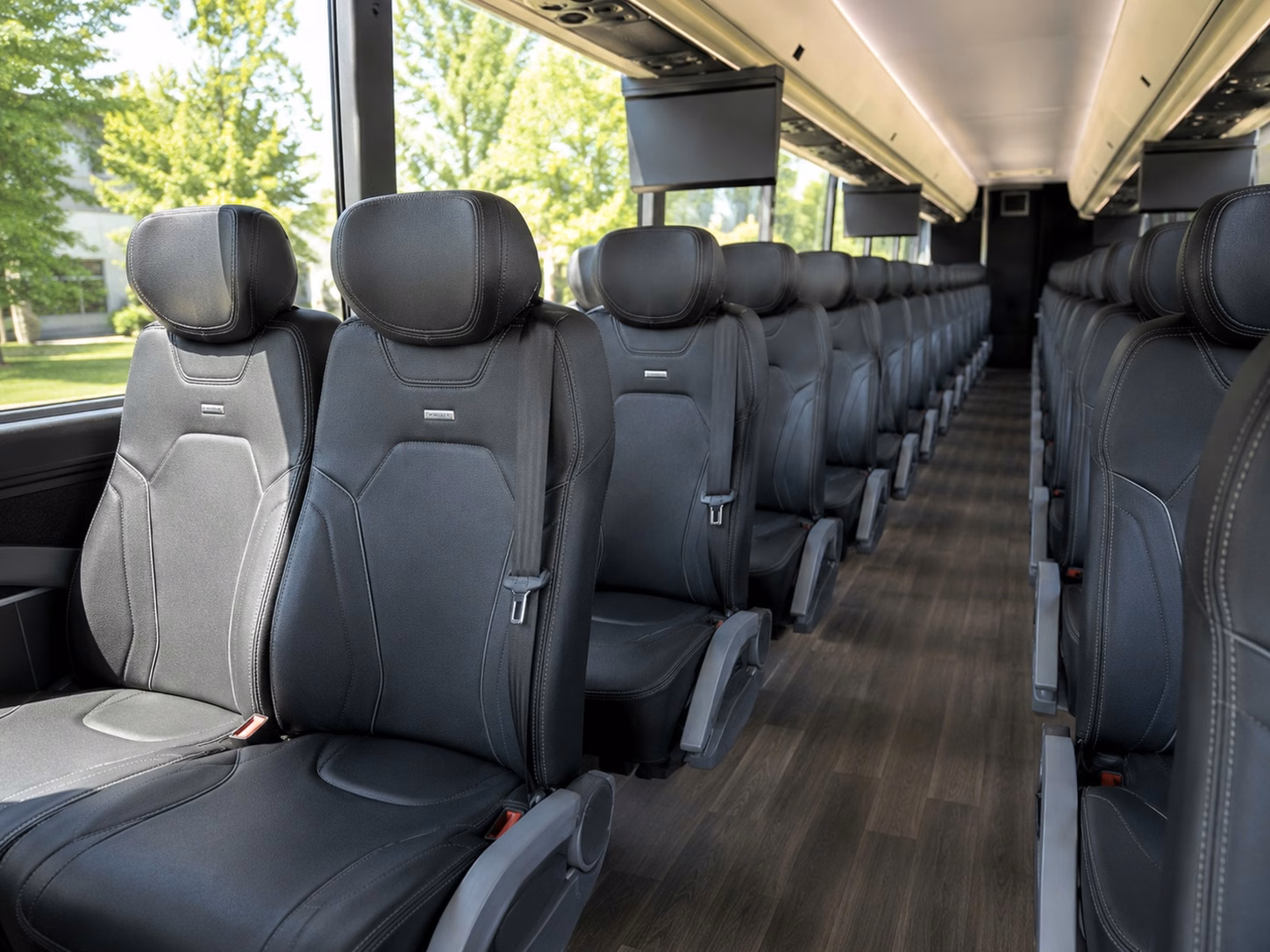 how trip distance and duration affect charter bus rates in dearborn